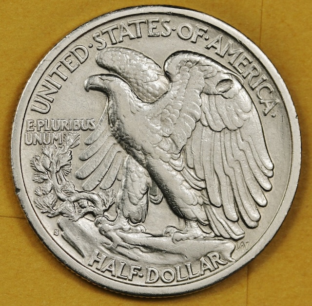 1939 Walking Liberty Half Dollar strikethrough error showing incuse impression from debris struck between die and planchet